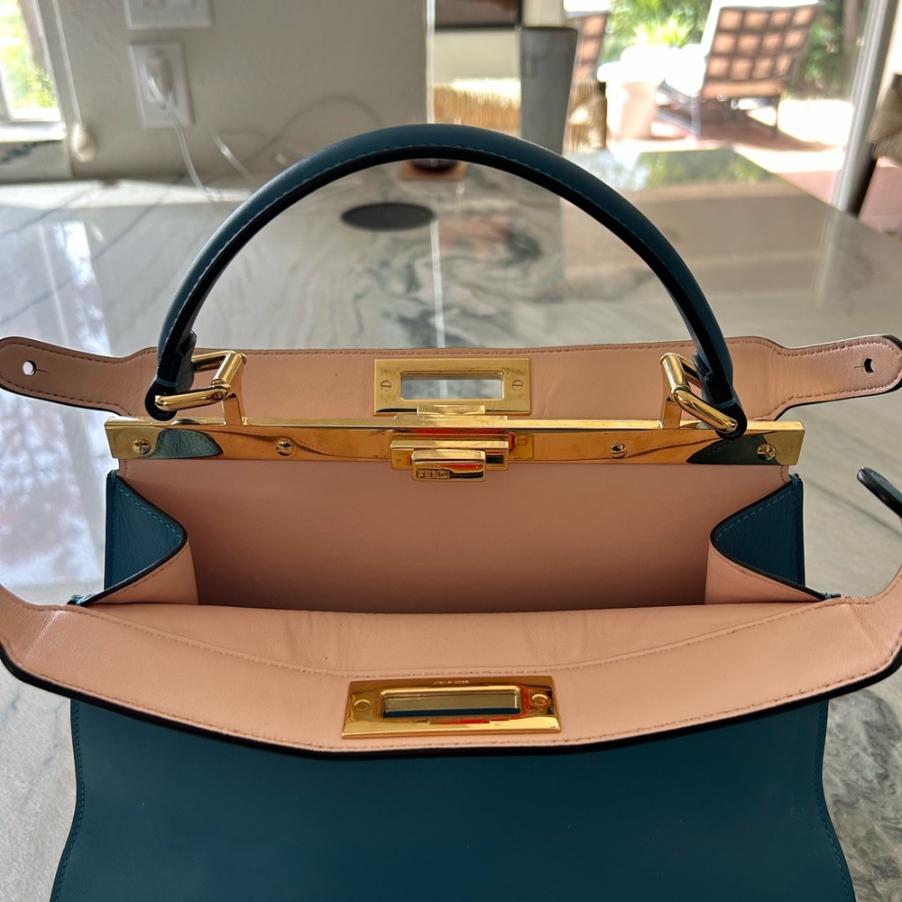 Absolutely stunning blue with pink leather interior. 100% authentic